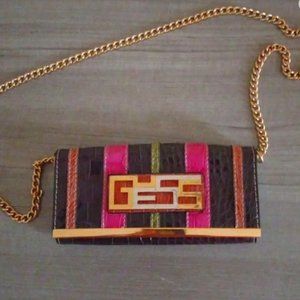 Guess pink & magenta clutch bag